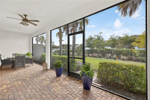 a view of a porch with furniture and yard