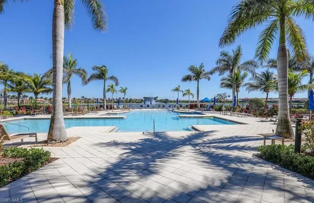 a view of swimming pool with chairs