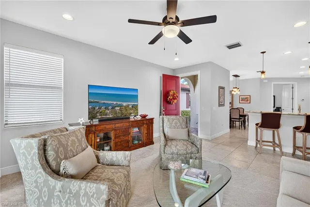 a living room with furniture and a window