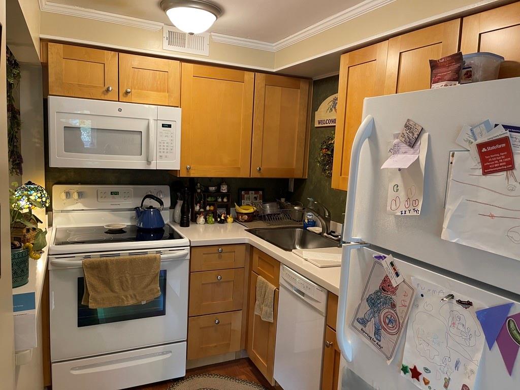 507 Hunters Path Road, Unit 12B Bridgeville, PA 15017 - Photo 11 of 25 a view of a refrigerator and a sink