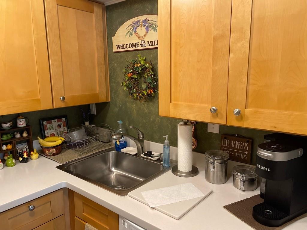 507 Hunters Path Road, Unit 12B Bridgeville, PA 15017 - Photo 12 of 25 a kitchen with a sink and cabinets