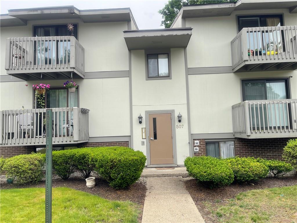 507 Hunters Path Road, Unit 12B Bridgeville, PA 15017 - Photo 2 of 25 a front view of a house with garden