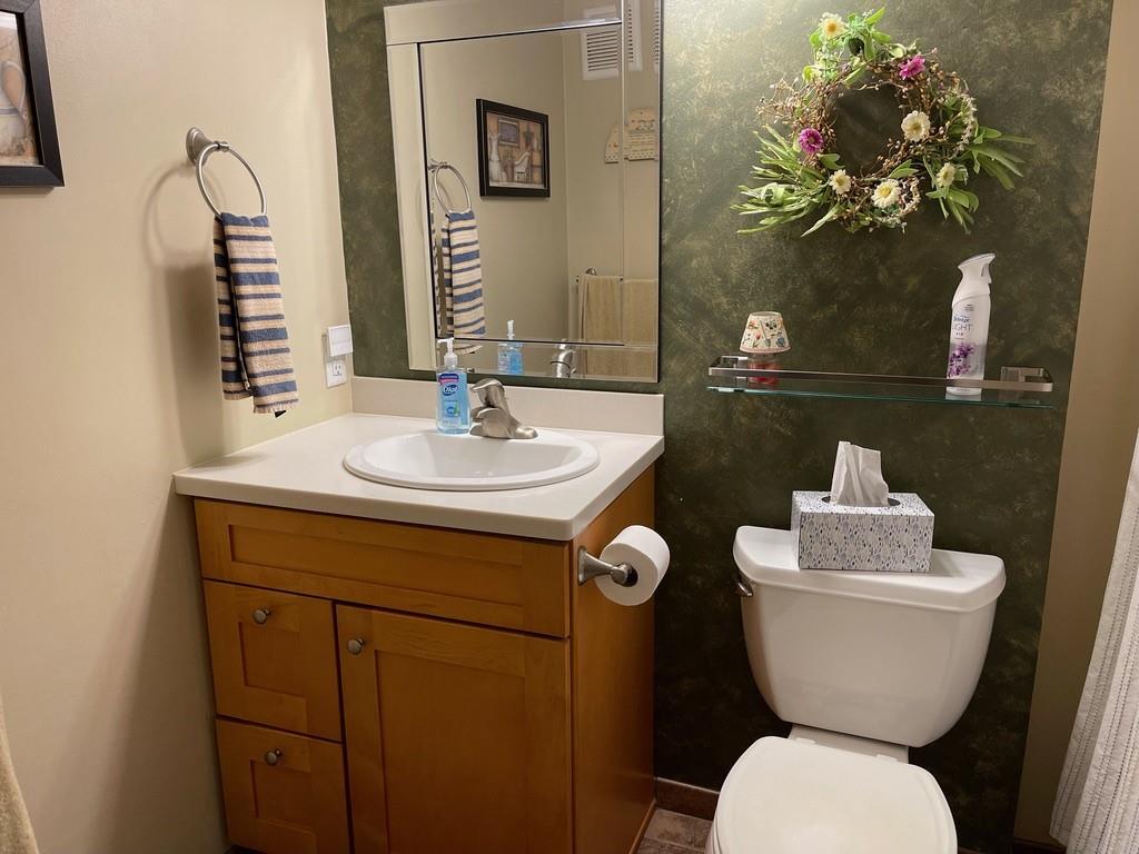 507 Hunters Path Road, Unit 12B Bridgeville, PA 15017 - Photo 21 of 25 a bathroom with a toilet sink and mirror