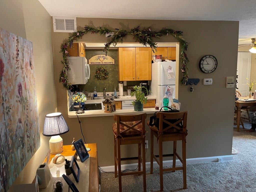 507 Hunters Path Road, Unit 12B Bridgeville, PA 15017 - Photo 5 of 25 a dining room with furniture and window