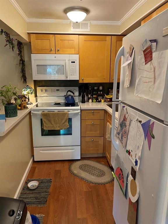 507 Hunters Path Road, Unit 12B Bridgeville, PA 15017 - Photo 8 of 25 a kitchen with a stove and a refrigerator