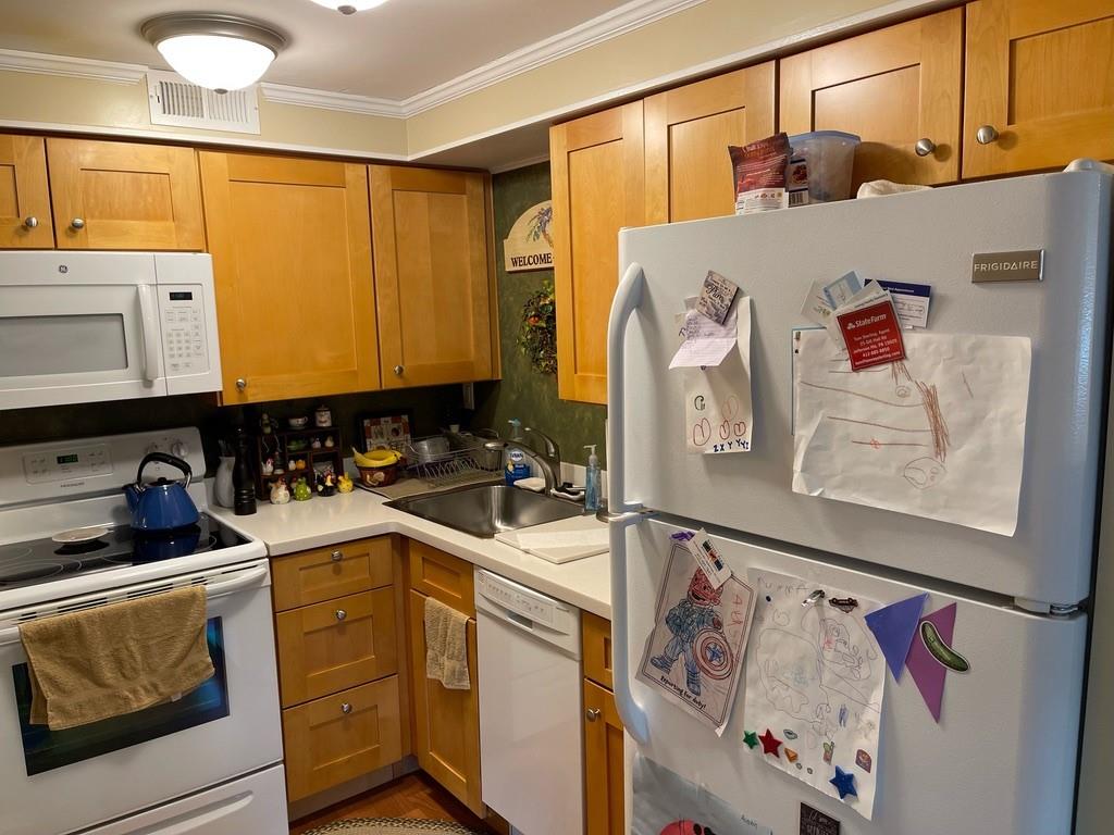 507 Hunters Path Road, Unit 12B Bridgeville, PA 15017 - Photo 10 of 25 a kitchen with a refrigerator and sink