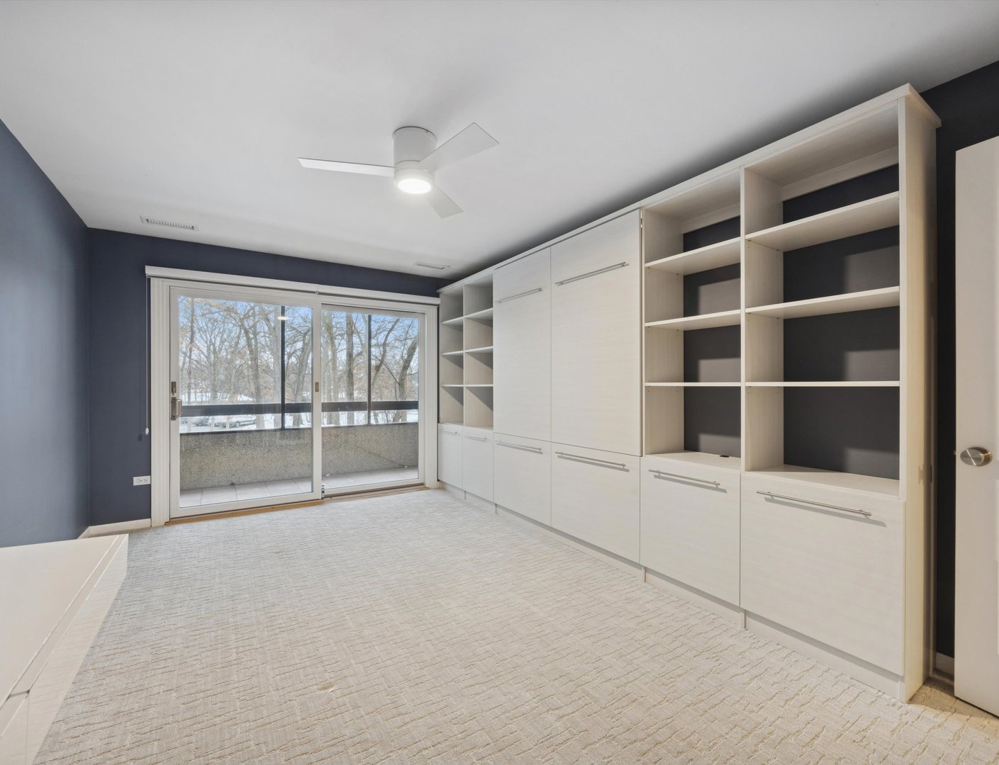 1401 Burr Oak Road, Unit 105B Hinsdale, IL 60521 - Photo 12 of 27 a view of an empty room with a window and cabinet