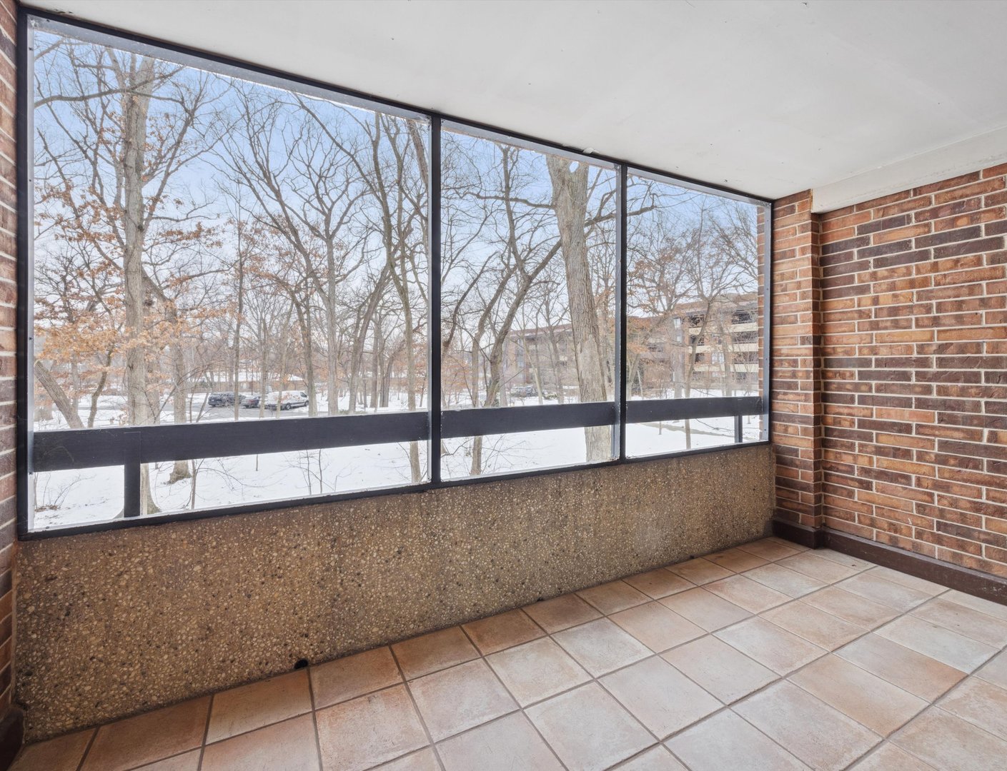 1401 Burr Oak Road, Unit 105B Hinsdale, IL 60521 - Photo 15 of 26 a view of wooden floor and trees in a room