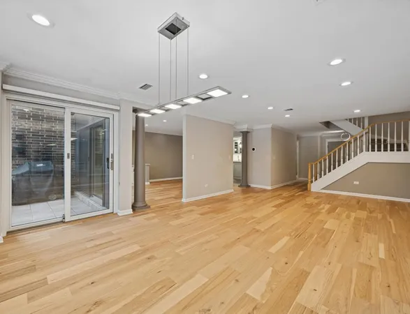 a view of an empty room with glass door