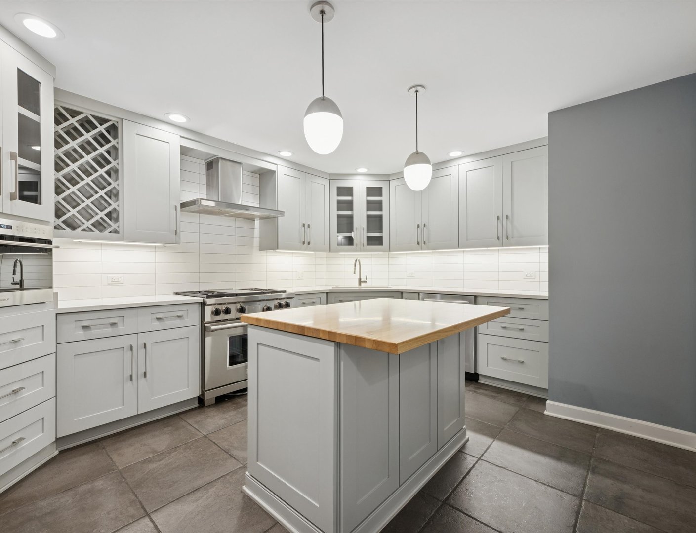 1401 Burr Oak Road, Unit 105B Hinsdale, IL 60521 - Photo 5 of 26 a kitchen with a sink stove and cabinets