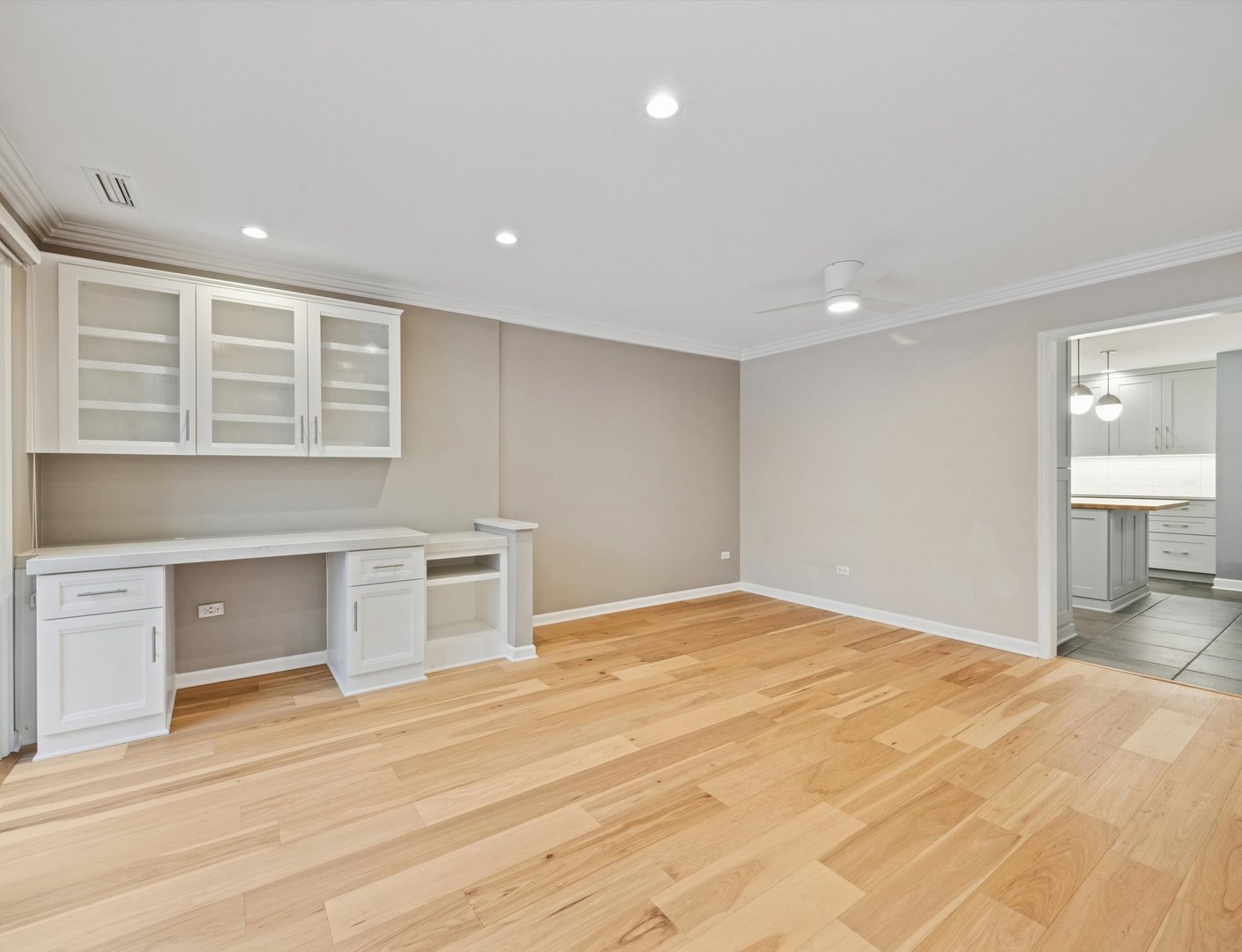 1401 Burr Oak Road, Unit 105B Hinsdale, IL 60521 - Photo 8 of 27 a view of empty room with wooden floor and window
