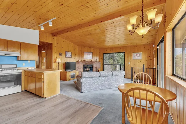 a kitchen with a sink a refrigerator and a window