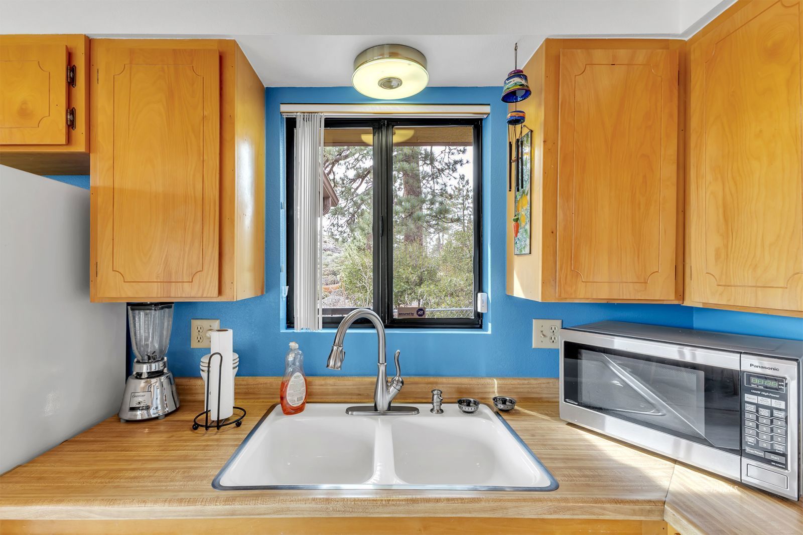 53440 West Ridge Road Idyllwild, CA 92549 - Photo 28 of 66 a kitchen with a sink a refrigerator and a window