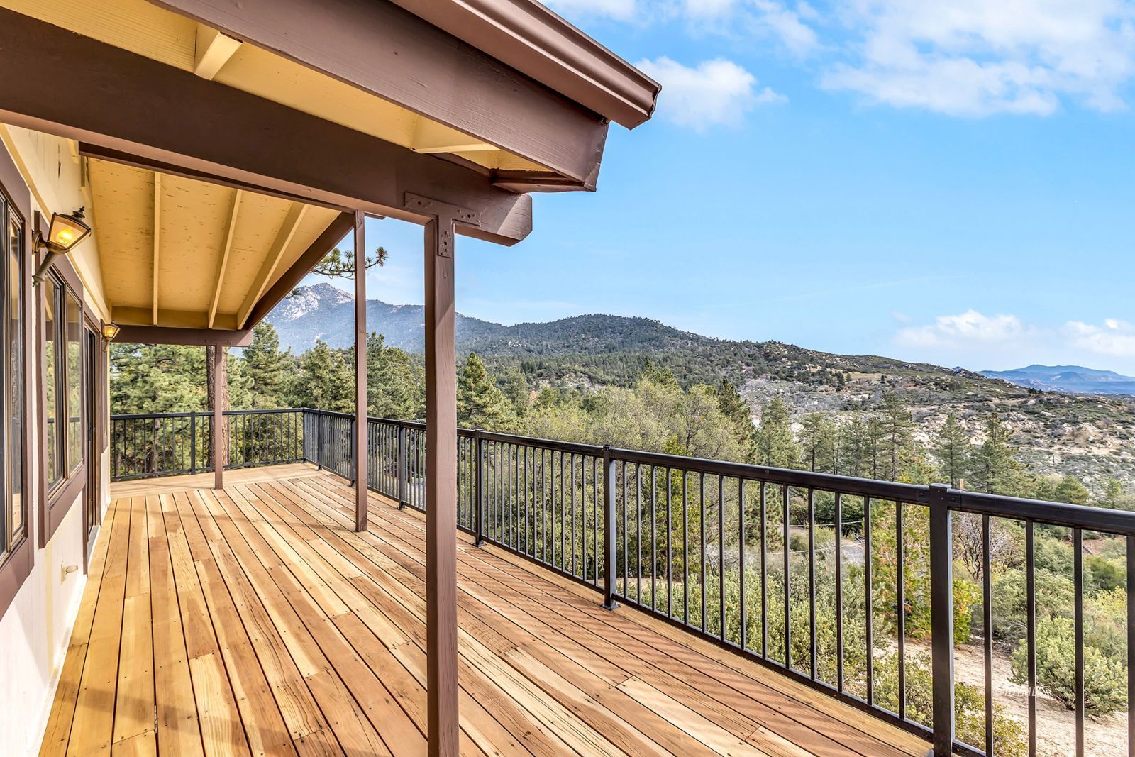 53440 West Ridge Road Idyllwild, CA 92549 - Photo 41 of 66 a view of a balcony with a floor to ceiling windows with wooden floor