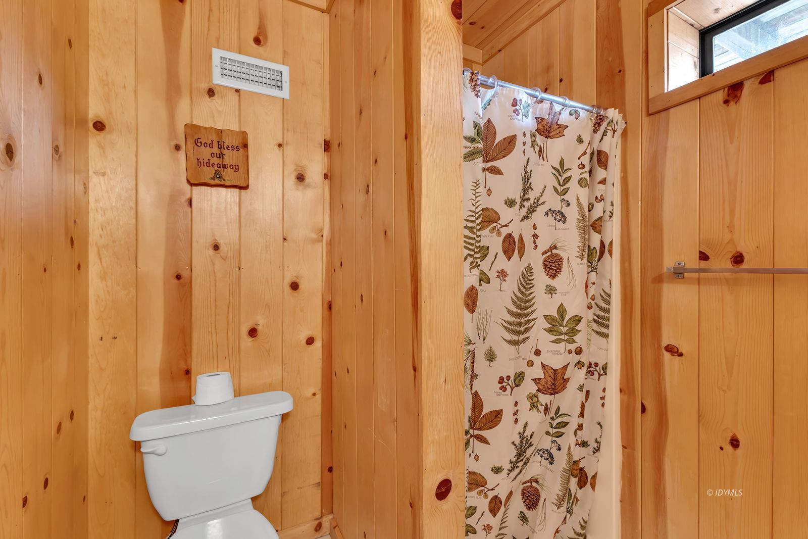 53440 West Ridge Road Idyllwild, CA 92549 - Photo 51 of 66 a bathroom with a toilet and shower curtain