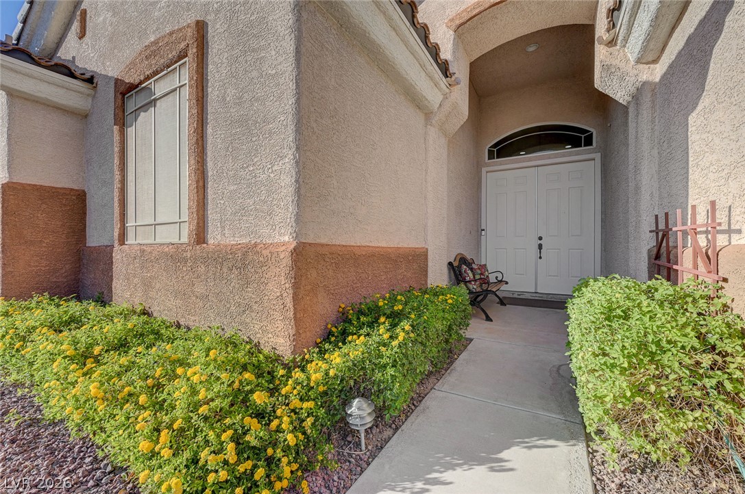 1604 Cattle Ranch Place Henderson, NV 89002 - Photo 10 of 99 A graceful entry beckons with a serene, landscaped pathway leading to the main entrance.