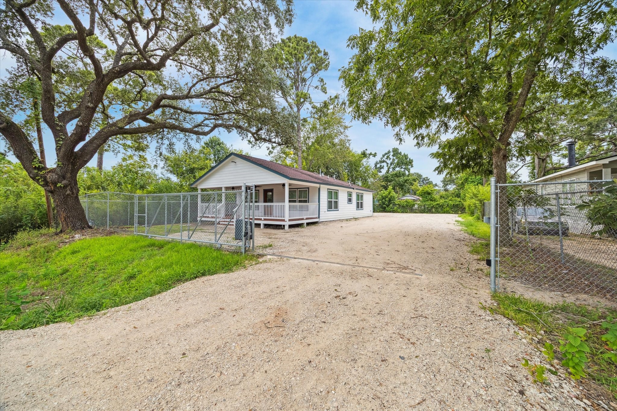 7229 Touchstone Street Houston, TX 77028 - Photo 2 of 11 a house with green field in front of it