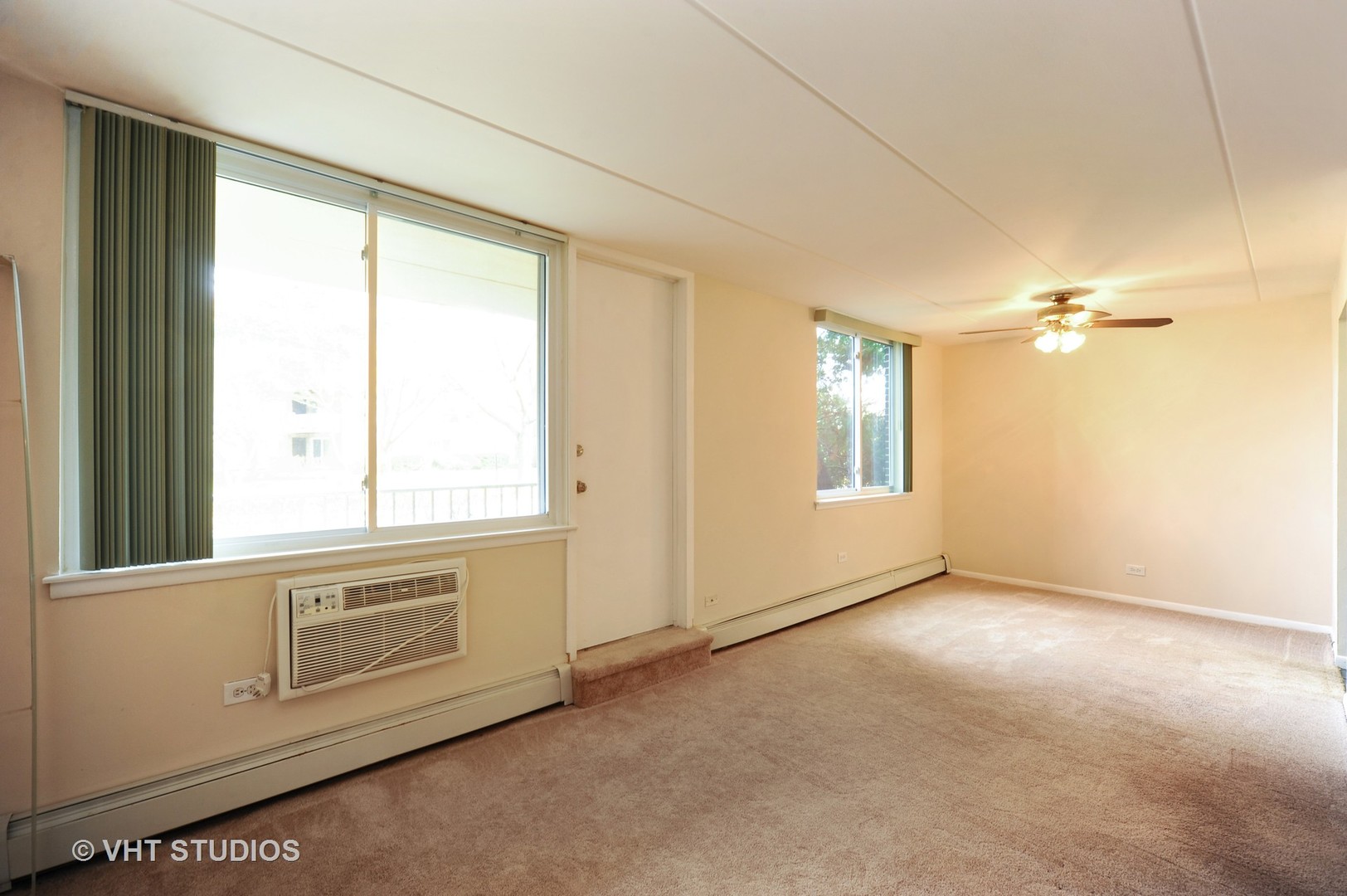 225 South Rohlwing Road, Unit 116 Palatine, IL 60074 - Photo 6 of 10 an empty room with windows
