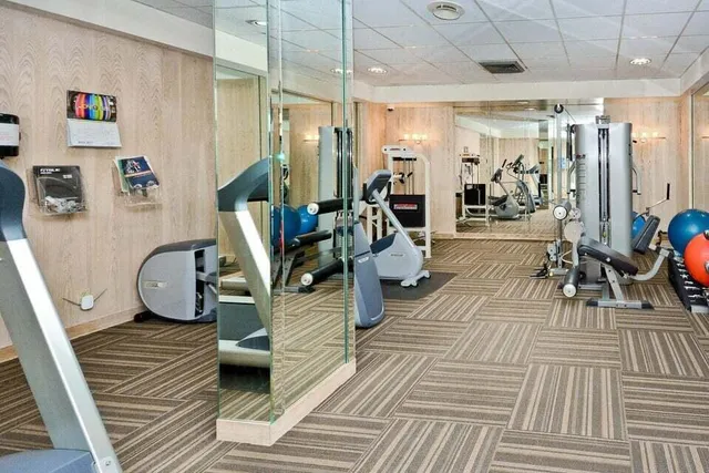 a living room with lots of furniture and air hockey table