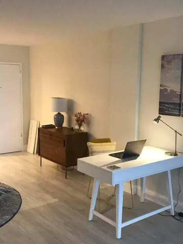 a workspace with furniture and lamp