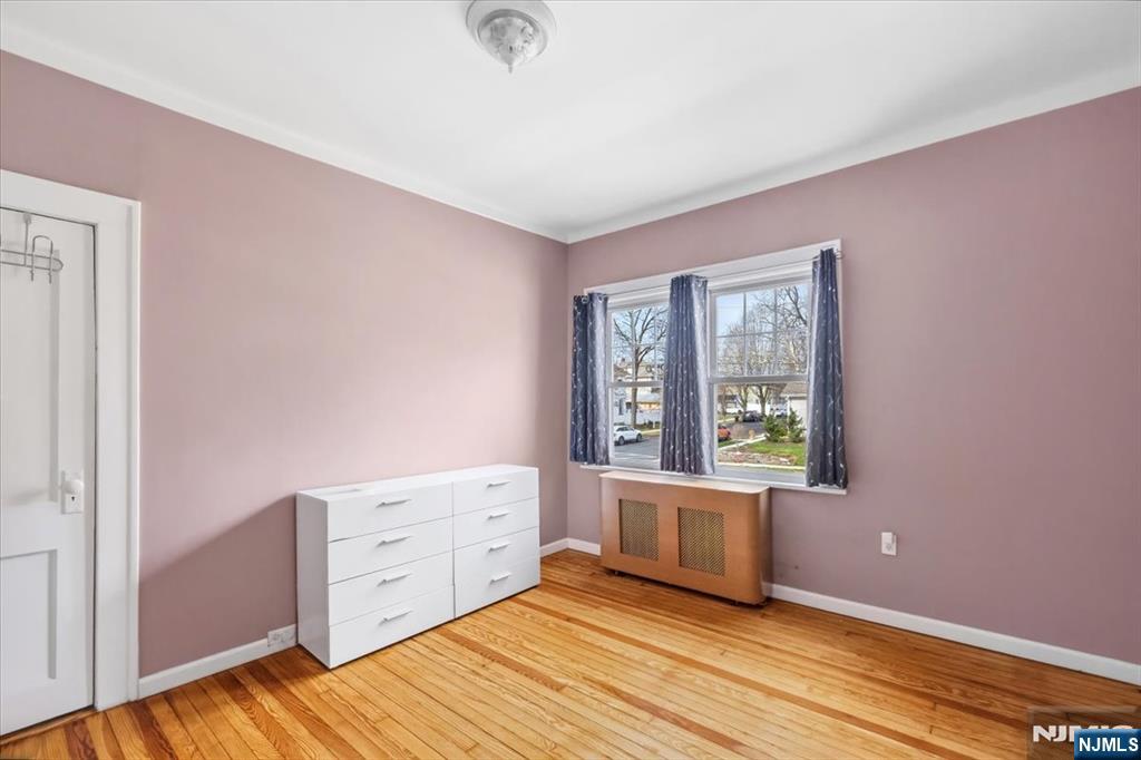 119 Overpeck Avenue Ridgefield Park, NJ 07660 - Photo 24 of 44 a view of a bedroom with furniture and window