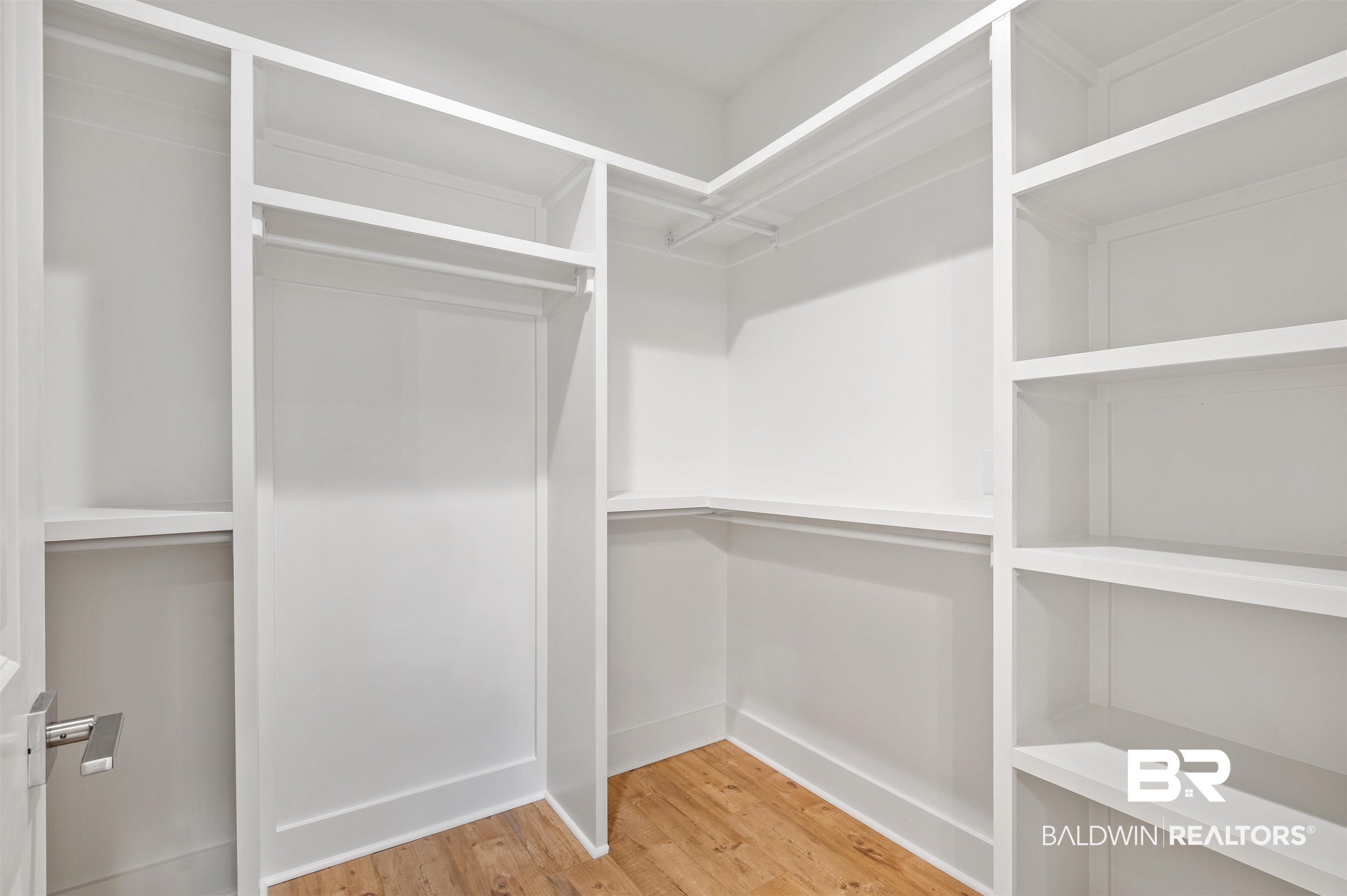 657 Island Way Gulf Shores, AL 36542 - Photo 23 of 59 Spacious closet with wood finished floors