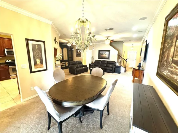 a living room with a bed furniture and a window