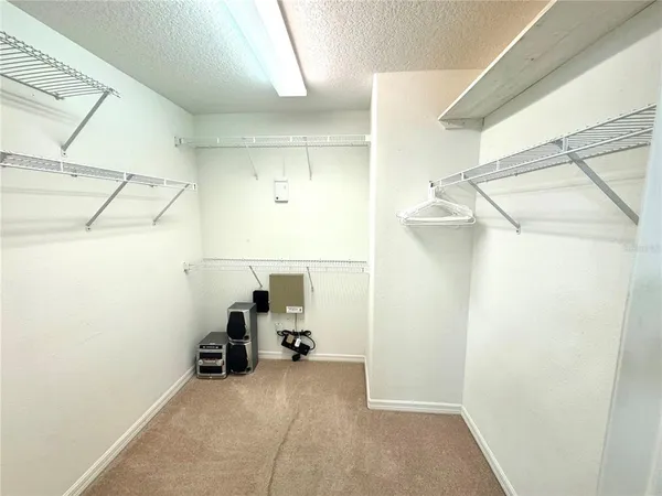 a bathroom with a tub sink shower and mirror