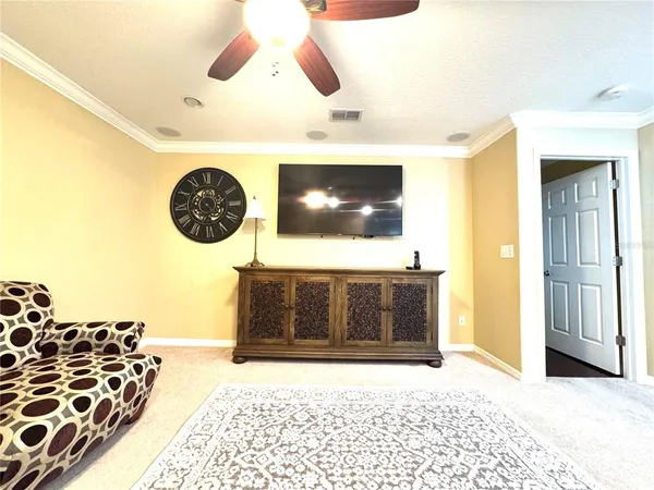 a living room with a couch and a flat screen tv