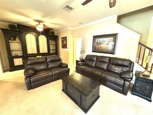 a kitchen with stainless steel appliances granite countertop a refrigerator a stove a sink dishwasher and wooden cabinets with a large window