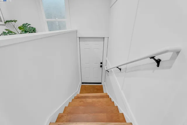 a view of a hallway with a white walls