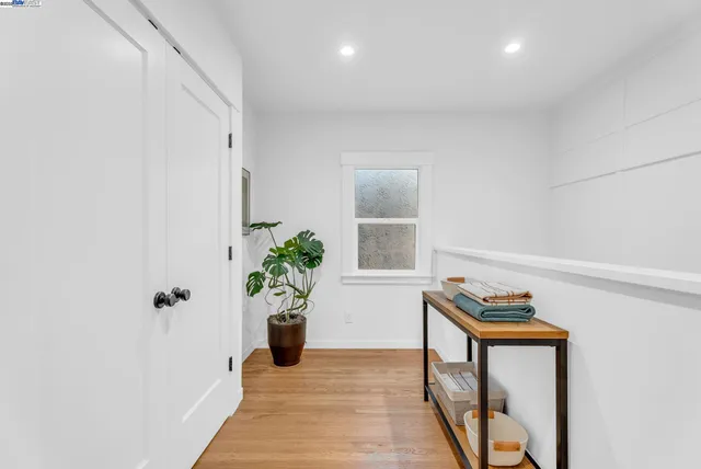 a view of an entryway with wooden floor