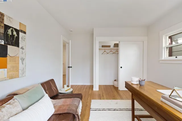 a bedroom with a bed and a couch