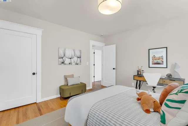 a bedroom with bed and window