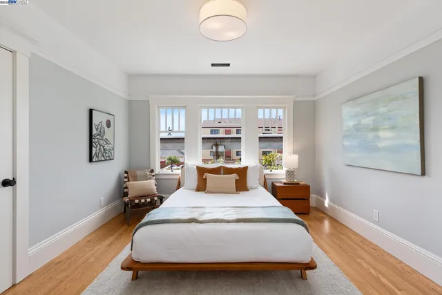 a bed room with a bed and window