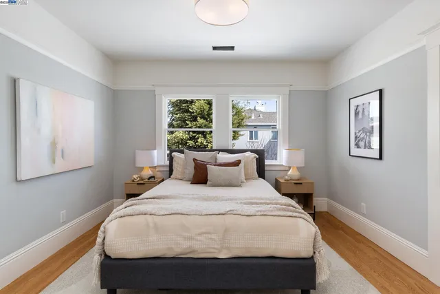 a bedroom with a large bed and a window