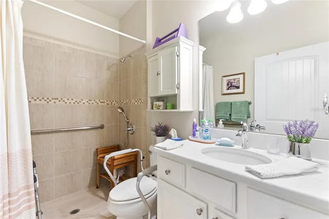 a view of a house with a yard potted plants and a big yard