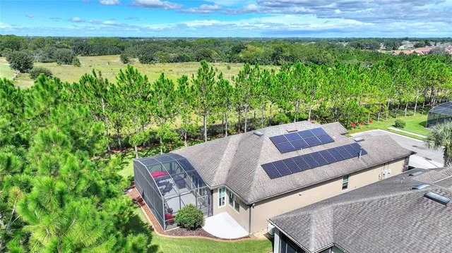 a large room with lots of furniture and a chandelier