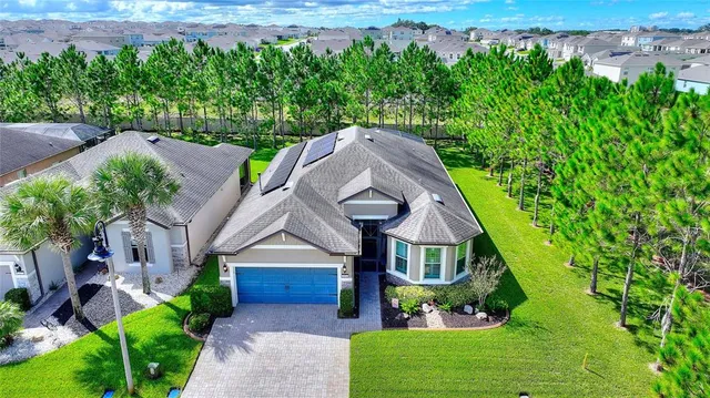 a living room with lots of furniture and view of kitchen