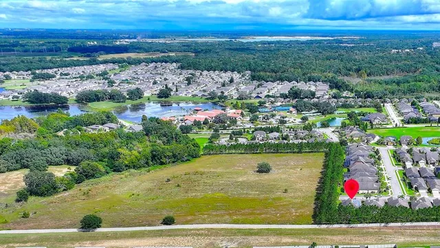 an aerial view of a house with a garden