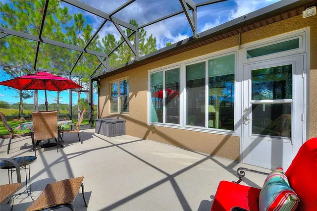 a kitchen with stainless steel appliances a kitchen island a stove a table and chairs in it