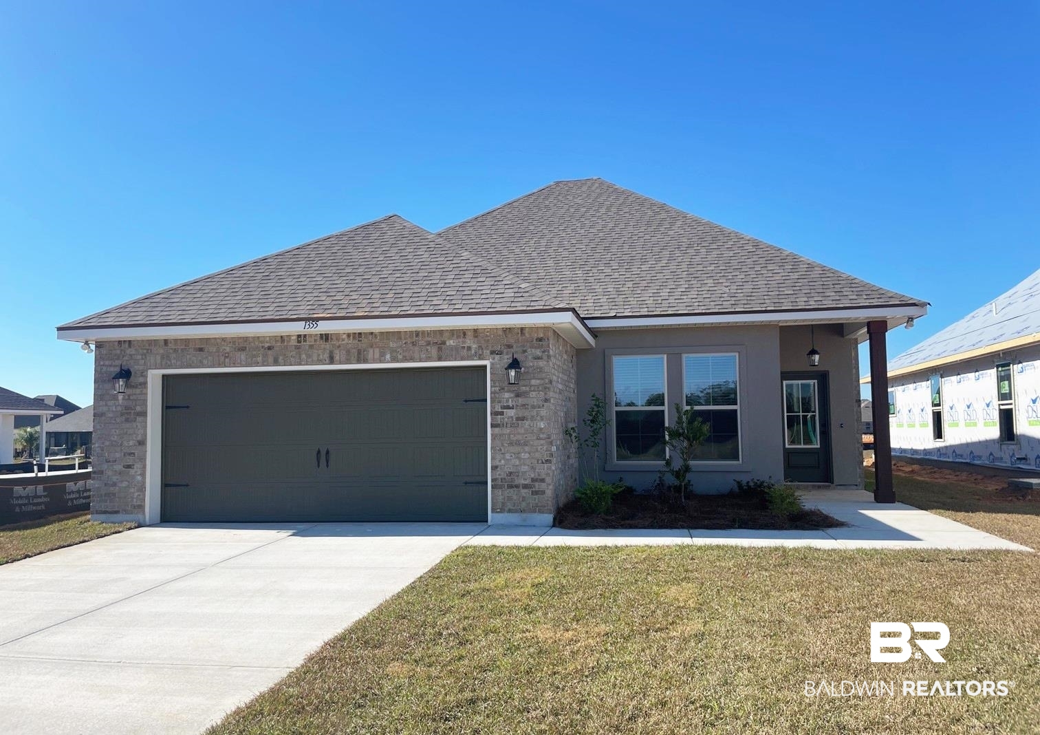 1355 Fenton Circle Foley, AL 36535 - Photo 1 of 17 View of front of home featuring a front lawn and a garage