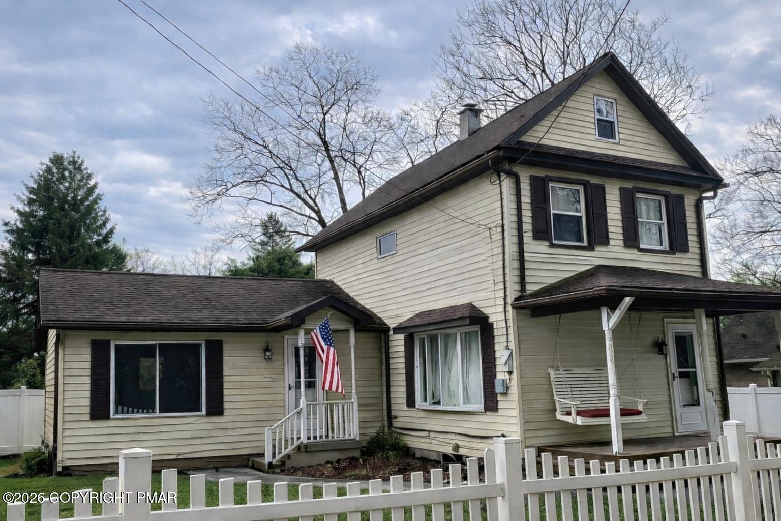 a front view of a house with glass windows