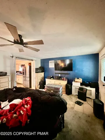 a bedroom with bed and a window