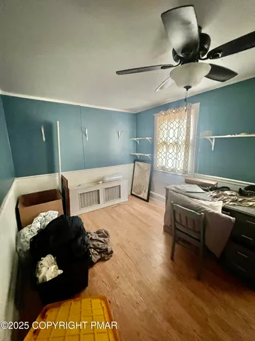 a bathroom with a sink a toilet a mirror and shower