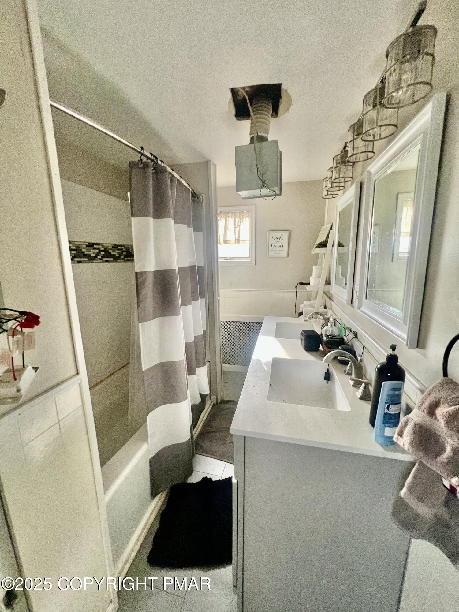 7 Orchard Street Trucksville, PA 18708 - Photo 16 of 19 a bathroom with a sink a toilet a mirror and shower