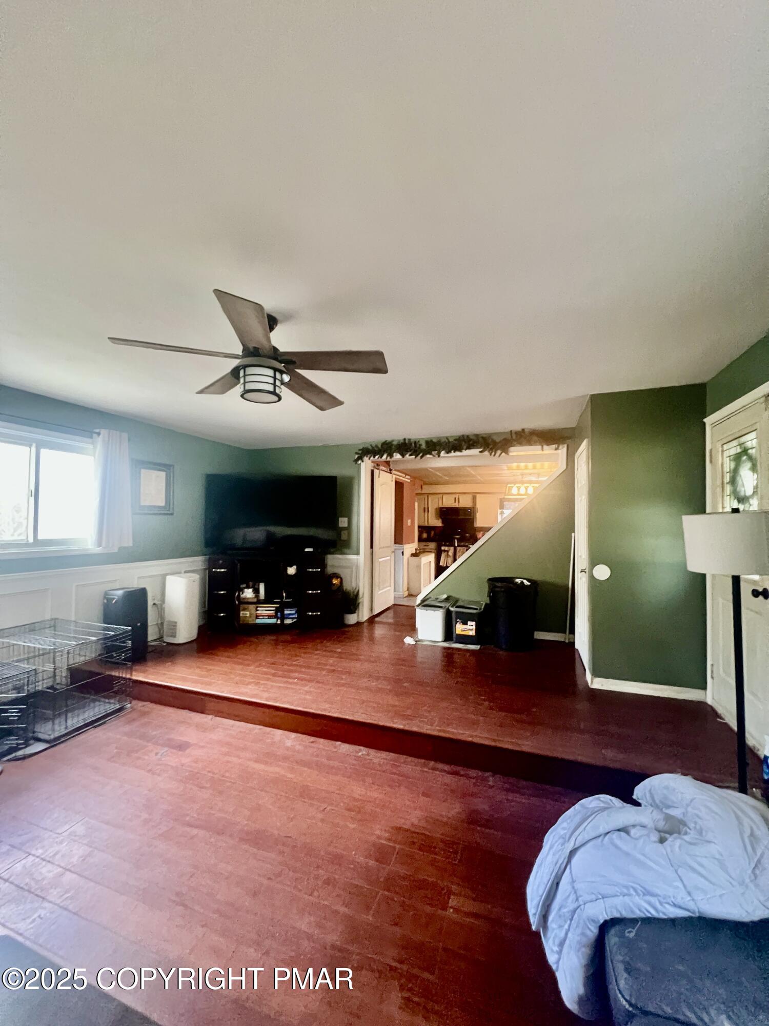 7 Orchard Street Trucksville, PA 18708 - Photo 18 of 19 a view of a livingroom with furniture and a ceiling fan