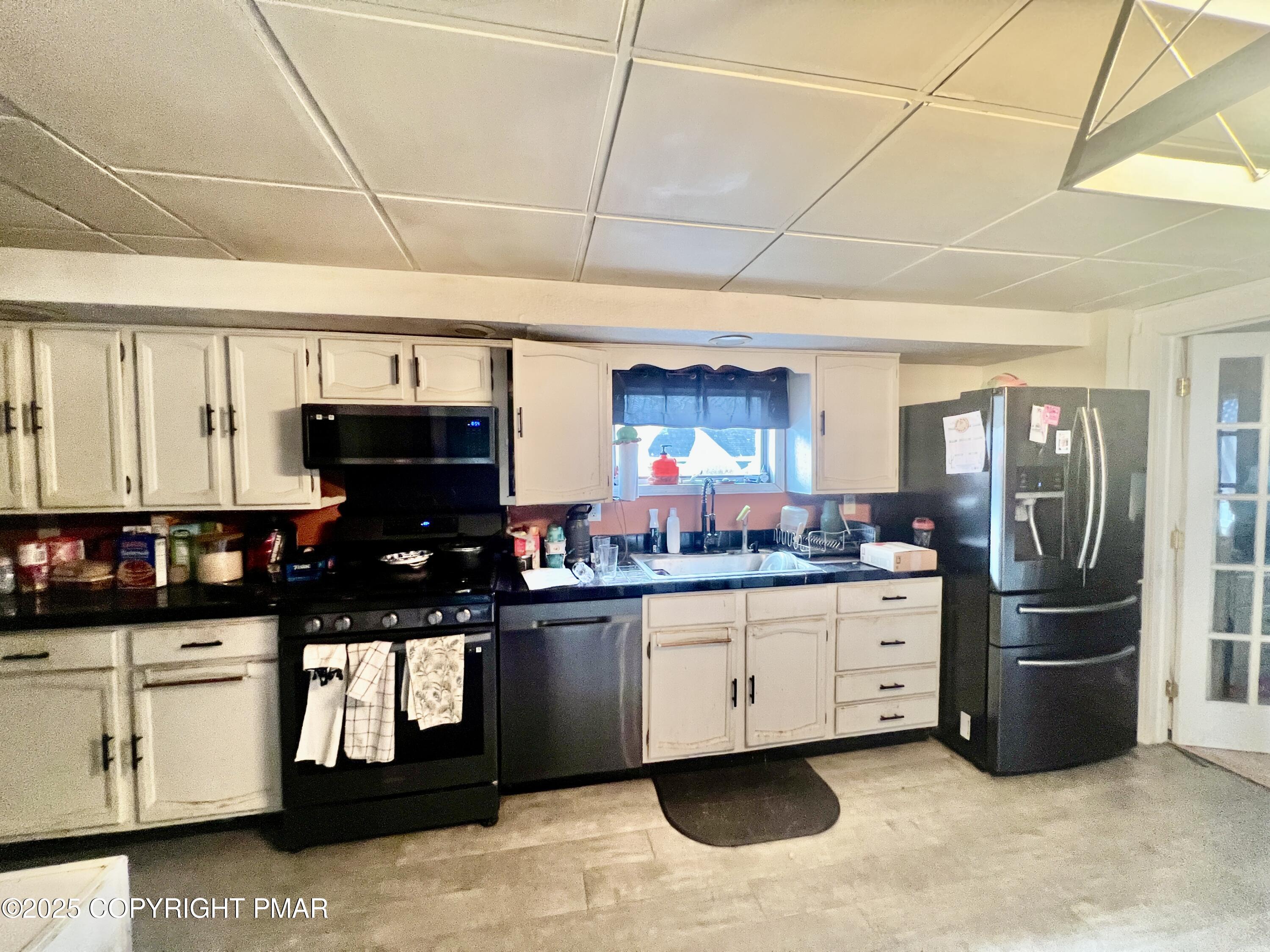 7 Orchard Street Trucksville, PA 18708 - Photo 7 of 19 a kitchen with granite countertop a sink and cabinets