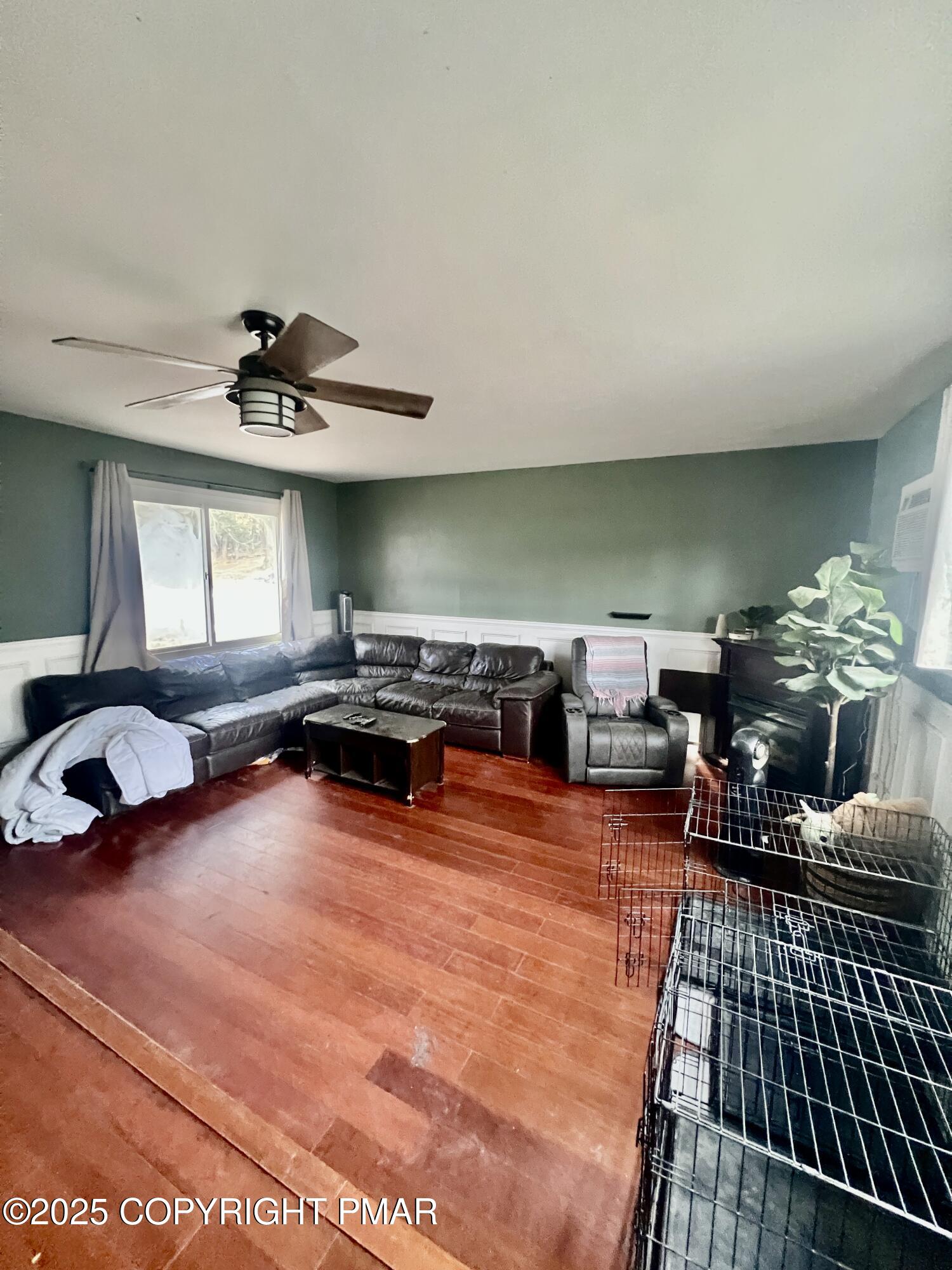 7 Orchard Street Trucksville, PA 18708 - Photo 8 of 19 a living room with furniture a pool table and a fireplace