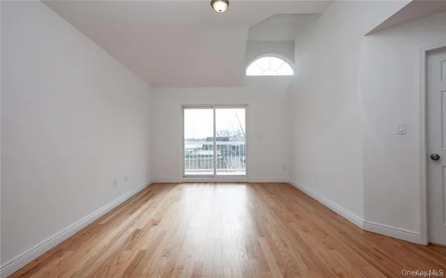 a view of kitchen with sink and wooden floor